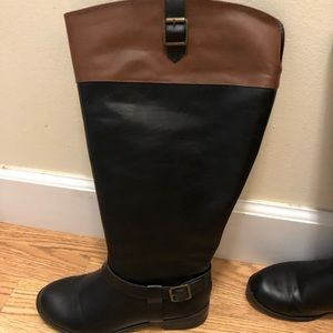Ready to wear black and brown tall boots